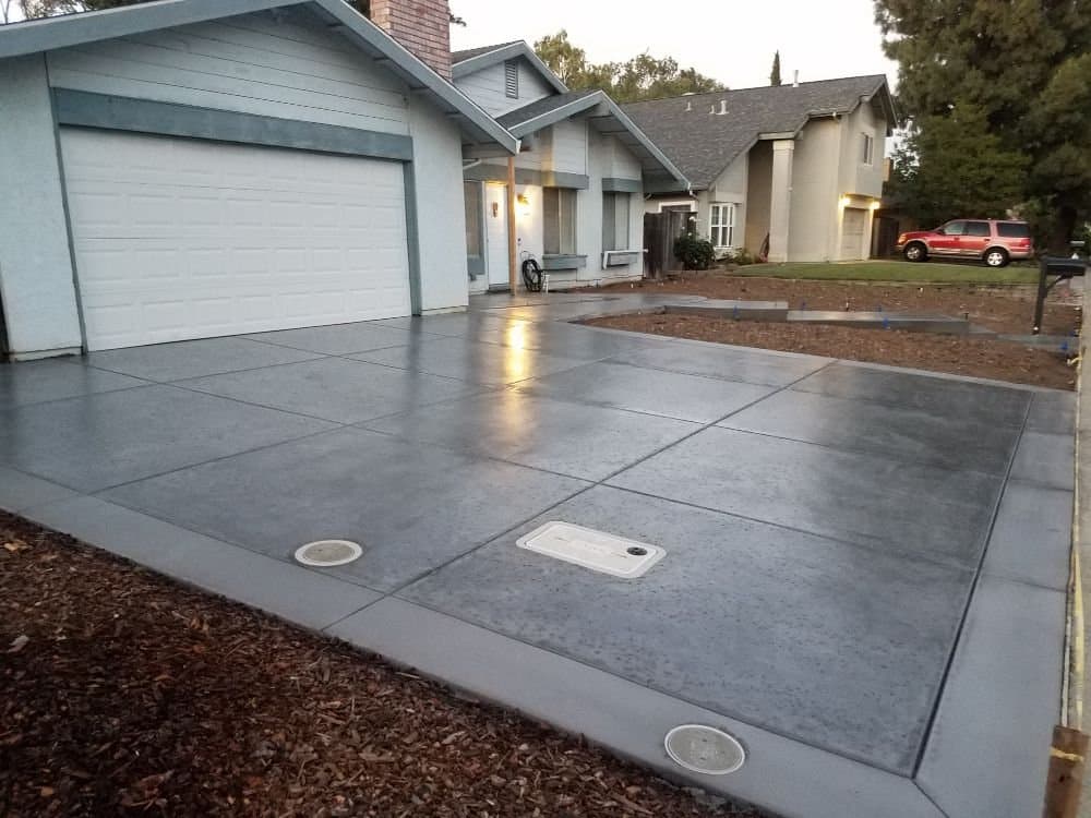 A finished two-car concrete driveway in the Sacramento area